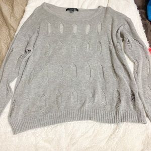 Forever 21 grey distressed knit sweater.